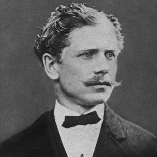 A black and white photograph of a young Ambrose Bierce wearing a dark suit with a white shirt and a bow tie. He has short, wavy hair and a distinct handlebar mustache.