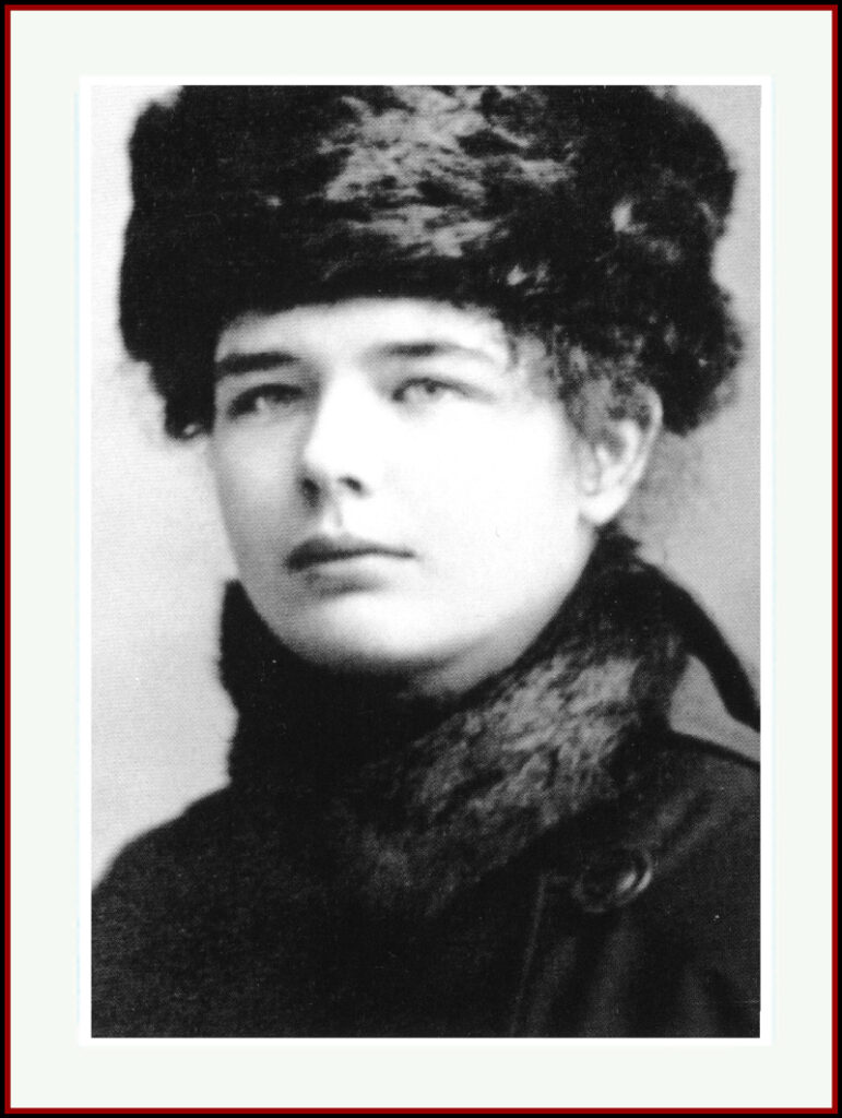 Black-and-white portrait of a young Marguerite Yourcenar wearing a thick fur hat and matching collar, gazing confidently into the distance.